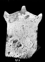 Top fragment of gravestone