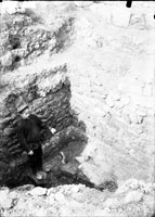 A pit in 1908 excavations in the north-eastern area of the ancient city, near two streets crossing