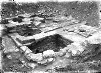 Ancient (Hellenistic) courtyard with well, pavement and remains of walls of adjoining rooms