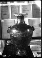 Black slip hydria with scratched ornament and applied clay decoration