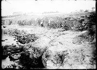 General view of the precipice in the seacoast: the edge of the excavation tench with numerous walls projectiong outside