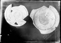 Glazed plates (two pieces), engraved, of red clay
